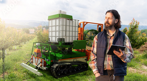 Cuadro en lienzo Autonomous robot sprayer works in a fruit garden