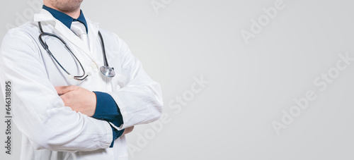 Banner of unrecognizable doctor with crossed arms with space for text. Crossed arms doctor medical banner