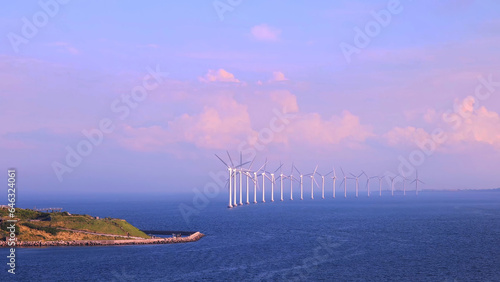 Renewable energy wind power plant and wind turbines along Denmark sea shoreline near Copenhagen.