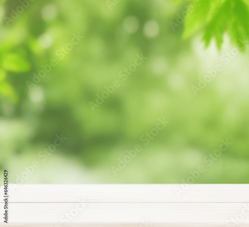 Background for the design, a white wooden table on a background of green trees and grass.