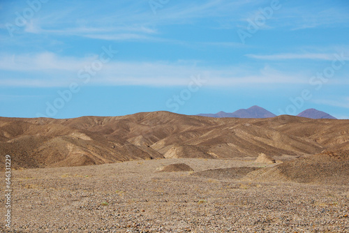 View of the slopes of the mountains in the desert. Sunny day.