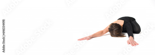Woman practices yoga on a white background