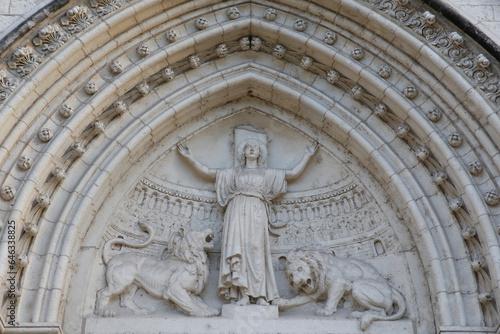 St. Blandine, patron saint of Lyon, depicted on the tympanum of a catholic church. Lyon, France.