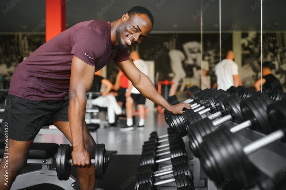 African American young man doing workout at the gym African American young man doing workout at the gym