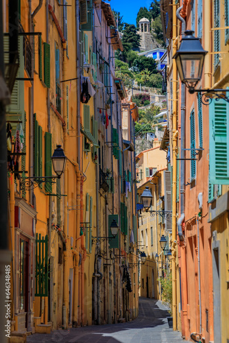 Picturesque narrow streets with colorful traditional houses in the old town of Menton, French Riviera, South of France