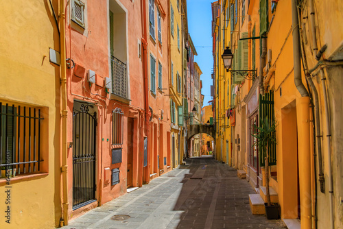 Picturesque narrow streets with colorful traditional houses in the old town of Menton  French Riviera  South of France