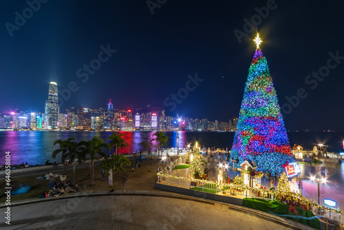 Scenery of Christmas tree and decoration with skyline of Victoria harbor of Hong Kong city photo