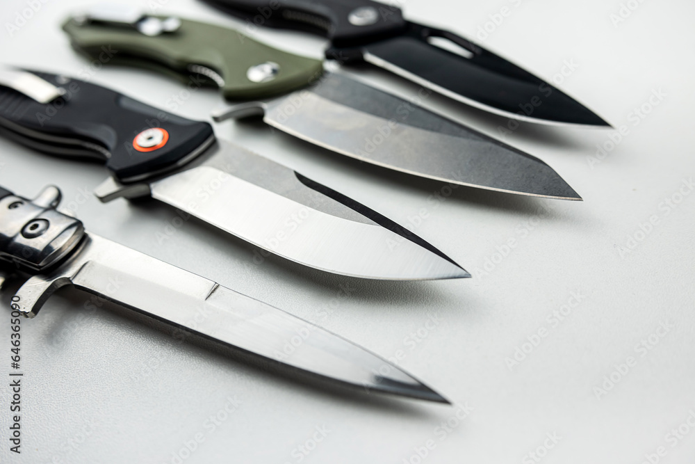 Fototapeta premium four sharp combat shiny knife isolated