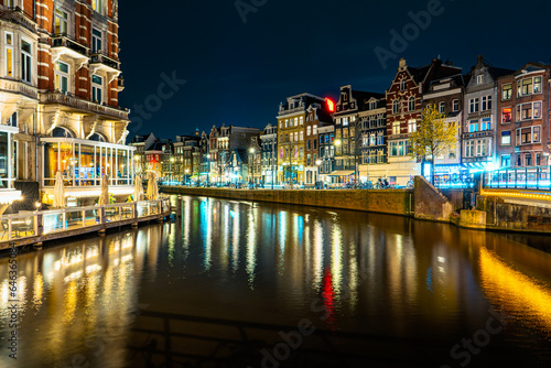 Photography Illuminated Canals and Riverside Delights: Exploring Amsterdam After Dark