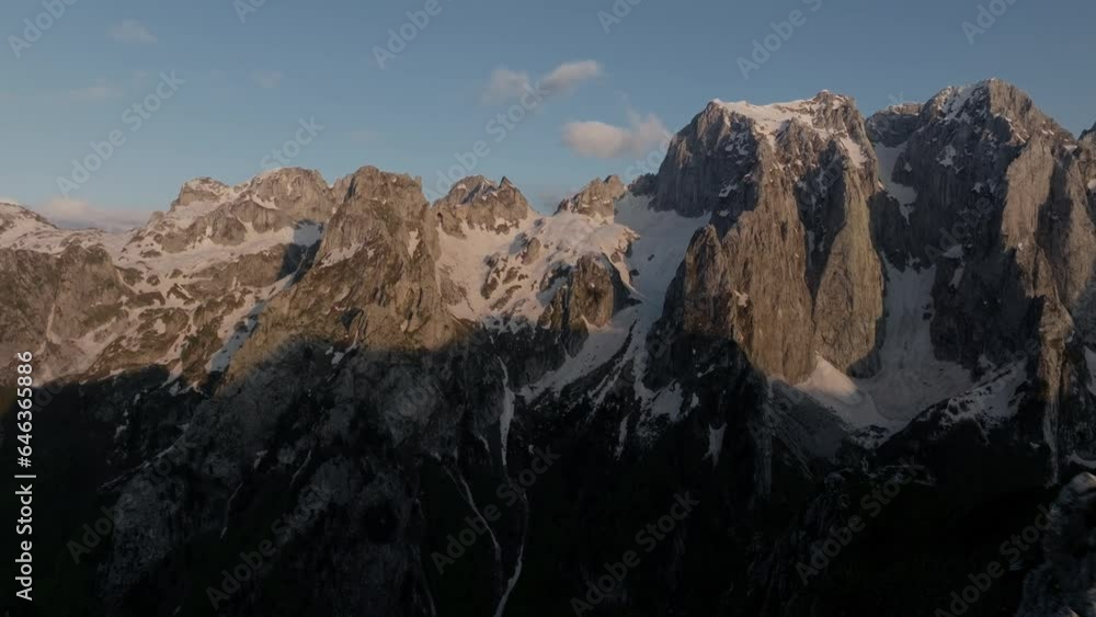 opening shot mountain karanfili in the national park prokletije - Montenegro, sunset light on the peak. aerial view opening shot mountain karanfili in the national park prokletije - Montenegro, sunset light on the peak. aerial view