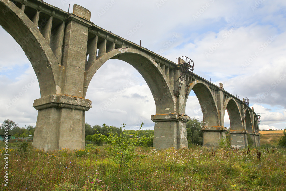 View of the abandoned old Mokrinsky railway bridge. Russia, the village of Mokry, the bridge was built in 1918