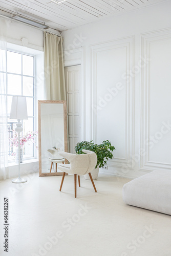 interior of a bright living room in a luxurious baroque style with white walls decorated with antique stucco © 4595886