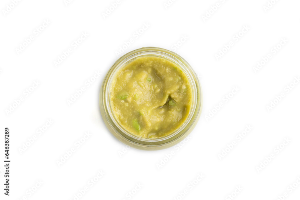 Baby puree with vegetable mix, broccoli, avocado in glass jar isolated on white, top view Baby puree with vegetable mix, broccoli, avocado in glass jar isolated on white, top view