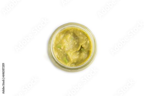 Baby puree with vegetable mix, broccoli, avocado in glass jar isolated on white, top view