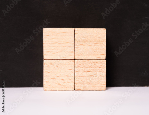 Four empty wooden cubes with place for letters or images
