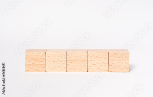 5 empty wooden cubes with place for letters