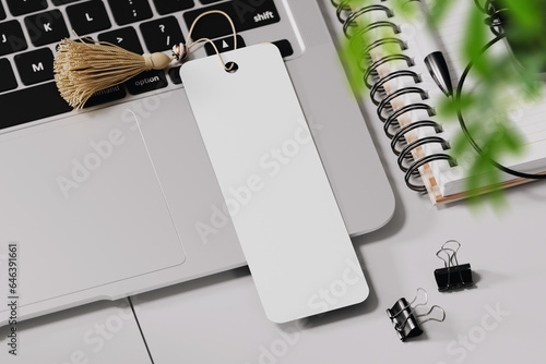 Bookmark with tassel on the laptop mockup. 3D rendering