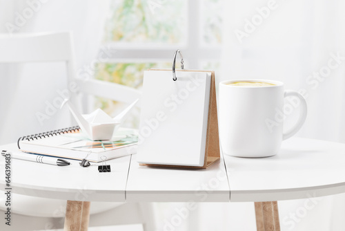 Daily desk calendar on the table mockup. 3D rendering © alex