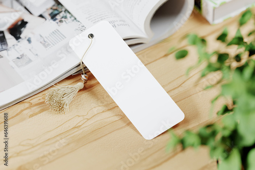 Cardboard bookmark with tassel mockup. 3D rendering photo