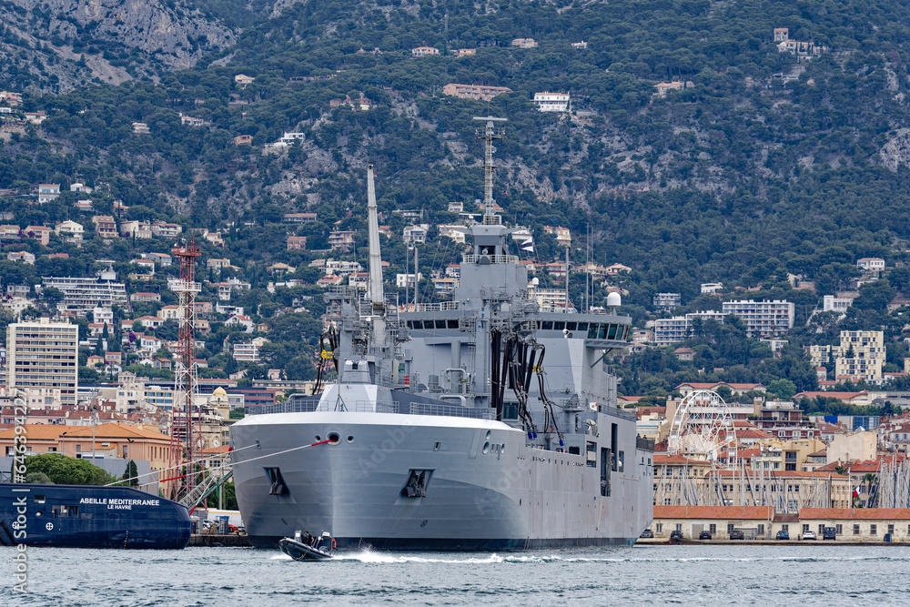 Moored supply warship and tanker of French Navy at Toulon Naval Base on a cloudy spring day. Photo taken June 9th, 2023, Toulon, France. Moored supply warship and tanker of French Navy at Toulon Naval Base on a cloudy spring day. Photo taken June 9th, 2023, Toulon, France.