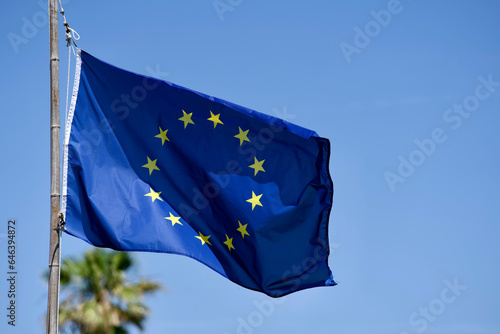 EU flag blowing in the wind at Giens peninsula on a sunny spring day. Photo taken June 8th, 2023, Giens, France.