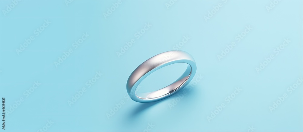Blue ring with silver isolated on a isolated pastel background Copy space Blue ring with silver isolated on a isolated pastel background Copy space