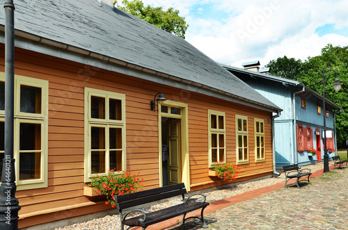 Restored old wooden houses with painted doors and window frames photo