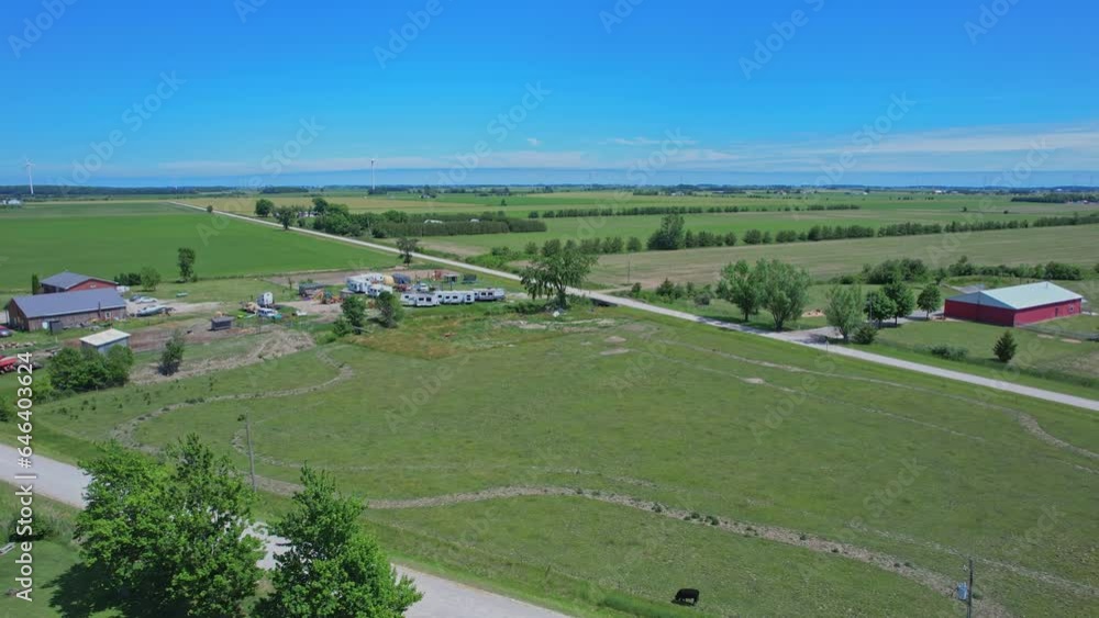 Shot of Canada south countryside at summer season, view from above. Farms and fields of wheat and crops. Rural Canadian county side landscape. Shot of Canada south countryside at summer season, view from above. Farms and fields of wheat and crops. Rural Canadian county side landscape.