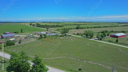 Shot of Canada south countryside at summer season, view from above. Farms and fields of wheat and crops. Rural Canadian county side landscape. photo