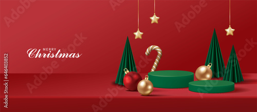 Christmas banner for product demonstration. Green pedestal or podium with bauble, candy cane and Christmas trees on red background.
