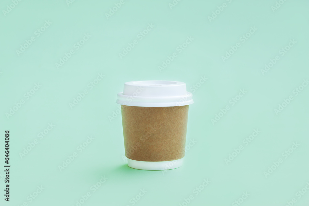White and Brown paper coffee cup on green background, Takeaway coffee cup White and Brown paper coffee cup on green background, Takeaway coffee cup