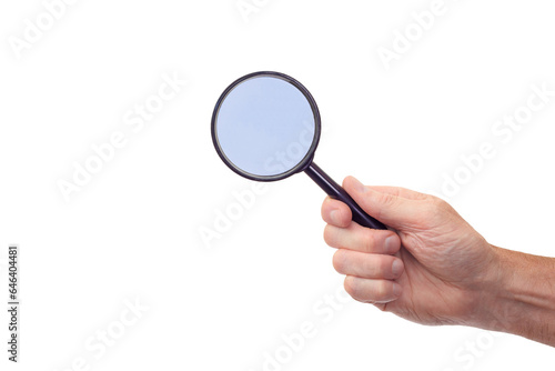 Hand grasping a magnifying glass with copy space