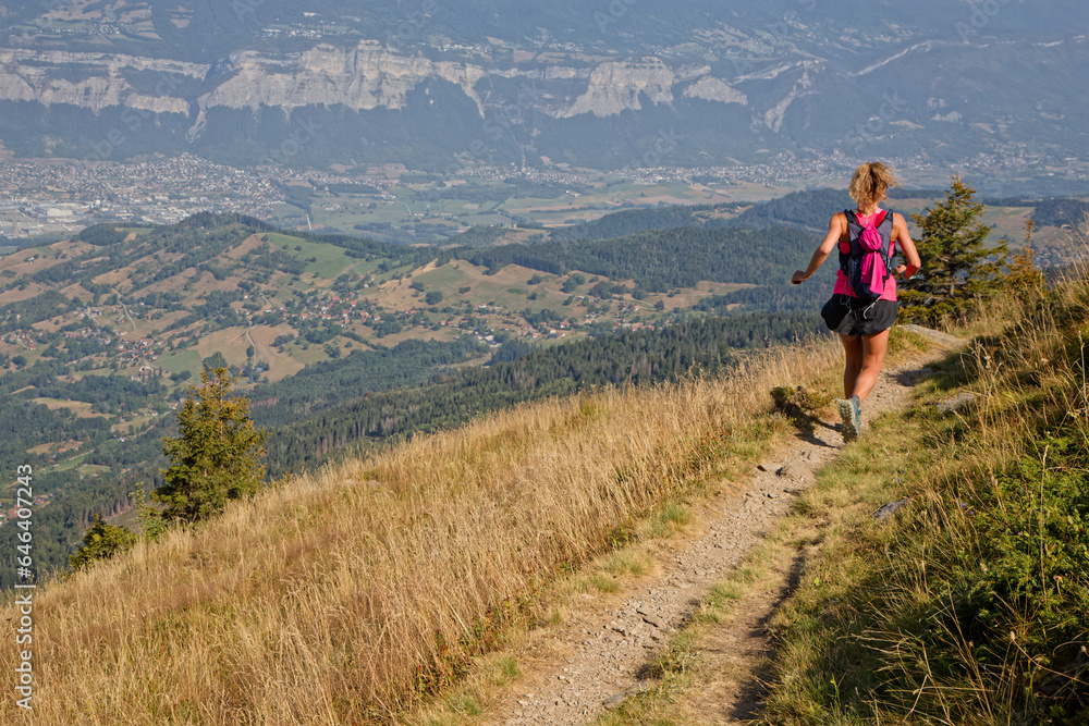 ST-AGNES, FRANCE, August 24, 2023 : Young woman runner trains on slopes of Belledonne before the ultra-trail that crosses the mountain range