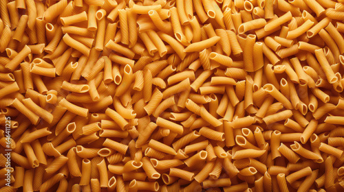 Texture of Italian pasta top view. Surface with lots of macaroni, backdrop. 