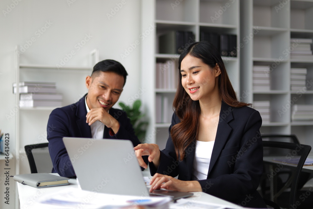 Boss and secretary working on documents together in office. Businessman and colleagues discussing in office collaboration. Boss and secretary working on documents together in office. Businessman and colleagues discussing in office collaboration.