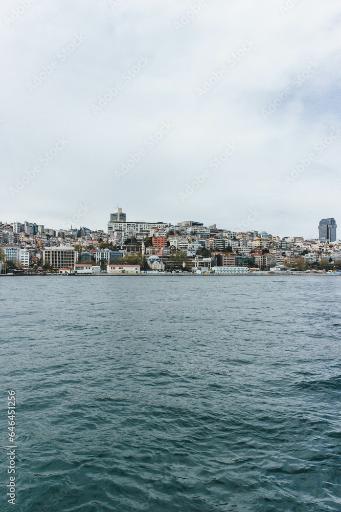 View of bosphorus strait water at mid day with beautiful light and bridge with skyline