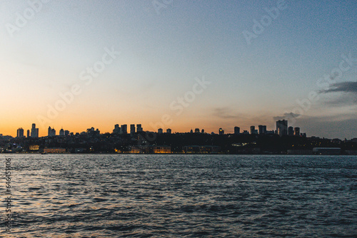View of bosphorus strait water at sunset with low light and skyline