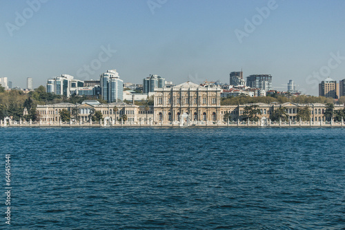View of bosphorus strait water at midday with blue waters and beautiful skyline with white palace © Radu
