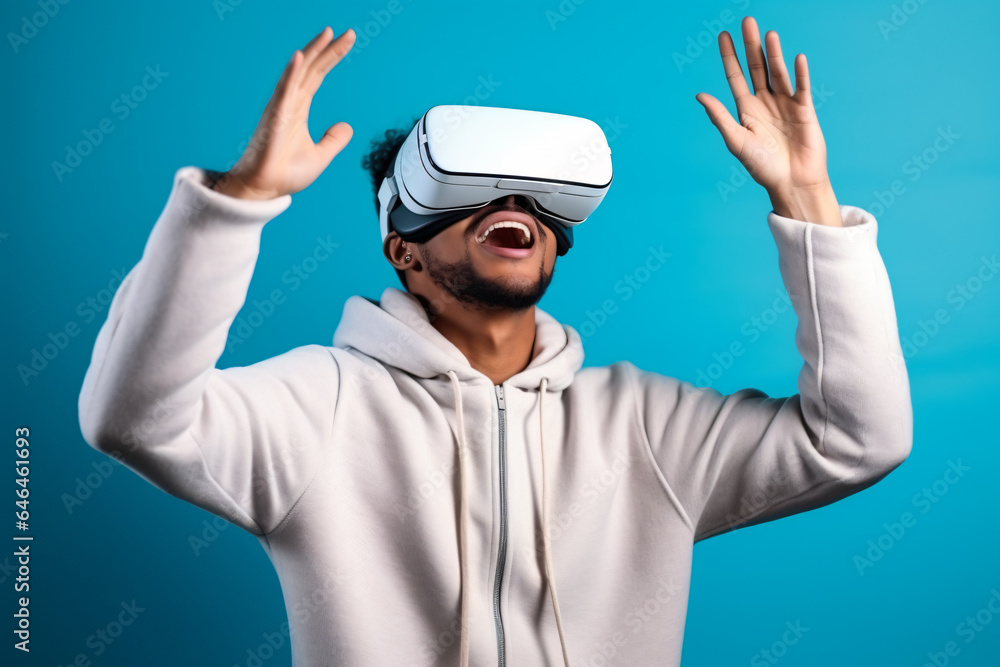 A young man is immersed in a virtual reality experience, wearing a VR headset and interacting with a digital world. A young man is immersed in a virtual reality experience, wearing a VR headset and interacting with a digital world.