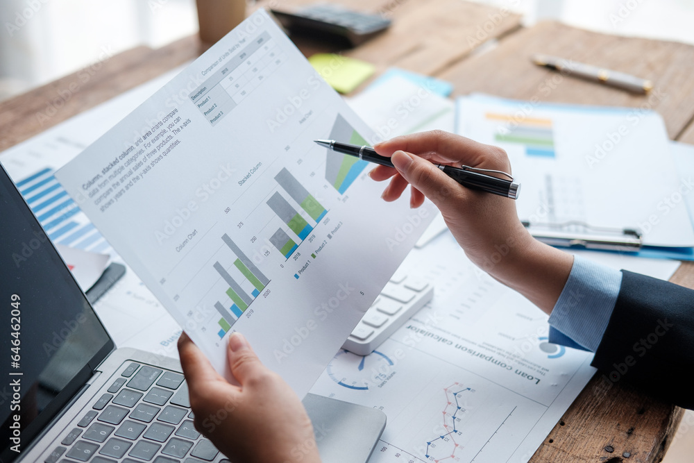 Businessman working with business report papers on office desk, financial chart analysis with calculator and accounting financial statement planning. Businessman working with business report papers on office desk, financial chart analysis with calculator and accounting financial statement planning.
