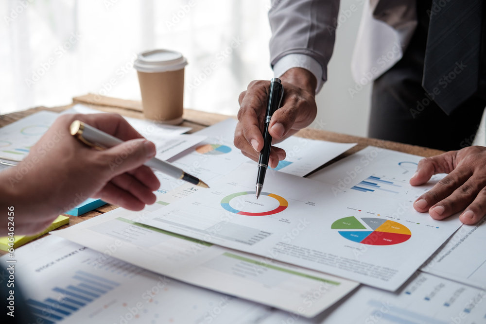 Team work process. Marketing strategy brainstorming. Paperwork and digital in office. Team work process. Marketing strategy brainstorming. Paperwork and digital in office.