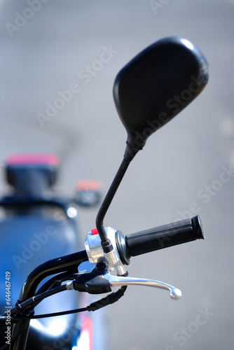 Focus on Handle Bar Grip and Rear View Mirror on Motorcycle for Driving