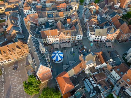 Halle, Flemish Brabant Region, Belgium, 06 09 2023, Sun rising over Halle, Aerial view, top down, of the Old market square with terraces in the center of the city of Halle. High quality photo. High photo