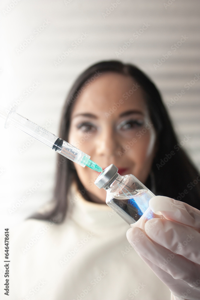 Woman doctor prepare injection protective biomolecular vaccine DNA genetic code cellular prevention supported by doctor recommending application and shows new vial and syringe