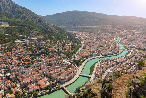 Amasya, Turkey - july 22, 2023 : Old Ottoman houses panoramic view by the Yesilirmak River in Amasya City. Amasya is populer tourist destination in Turkey.