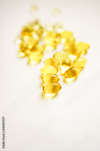 yellow capsules on a white background. medicines and vitamins