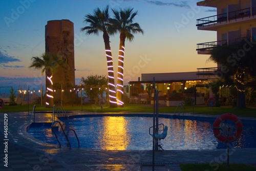 The swwimming pool ofa hotel in the evening photo