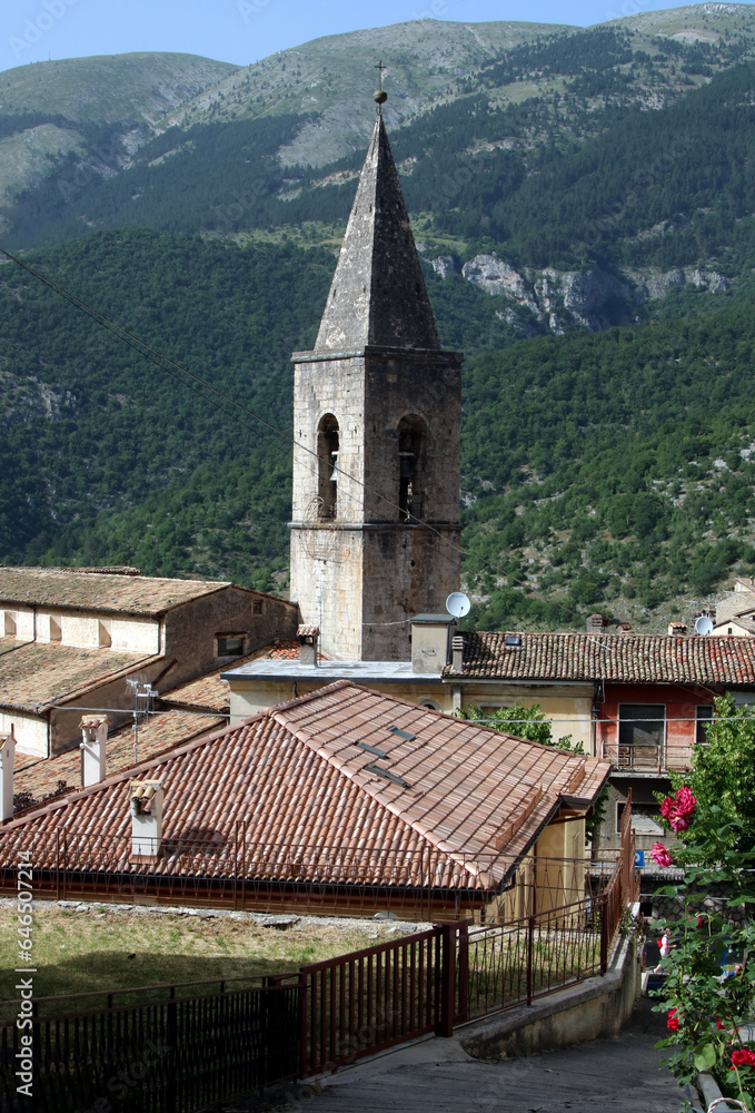 Enjoy a charming view of the bell tower of Santa Maria della Valle Church nestled within the small village of Scanno, Italy. This picturesque scene captures the essence of historical beauty