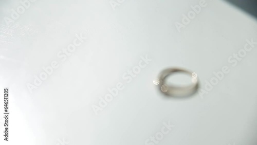 The wedding ring lies on the windowsill in the sunshine. Full HD