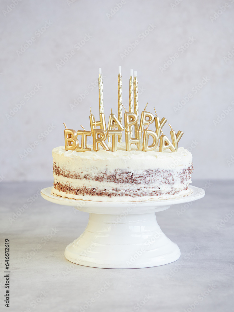 elegant cake on stand with happy birthday letter candles and other four ...
